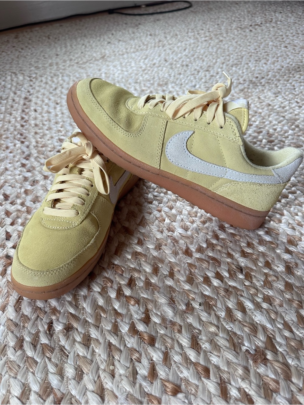 Nike Low-Top Sneakers in Pale Yellow with White Swoosh and Gum Sole